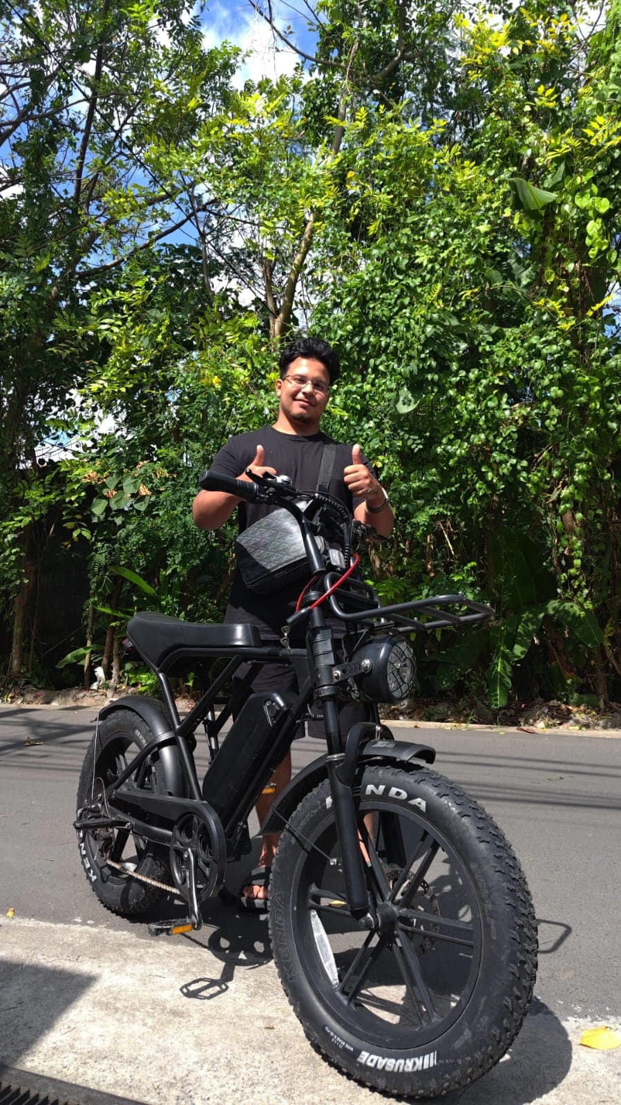 Customer riding an e-bike on a Bali street